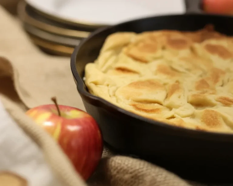 Delicious Apple Puff Pancake baked with cinnamon and fresh apples