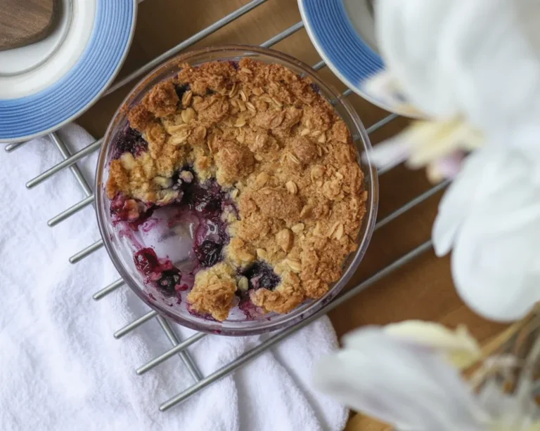 Nutty Blueberry Oatmeal topped with fresh blueberries and nuts in a bowl.