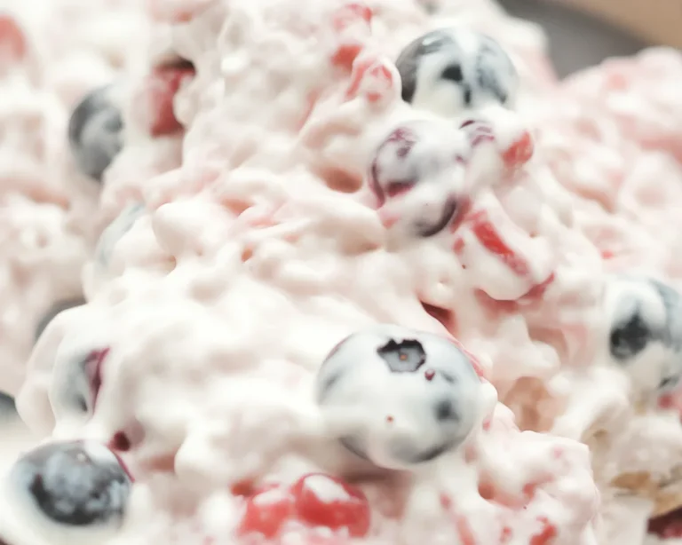 Creamy Very Berry Cheesecake Salad with fresh strawberries, blueberries, raspberries, and blackberries.