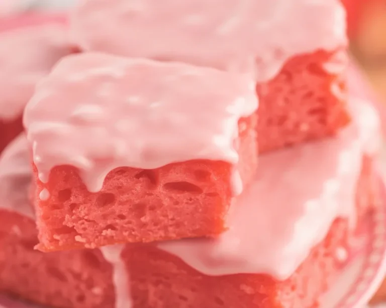 Delicious Strawberry Brownies topped with glaze and fresh strawberries
